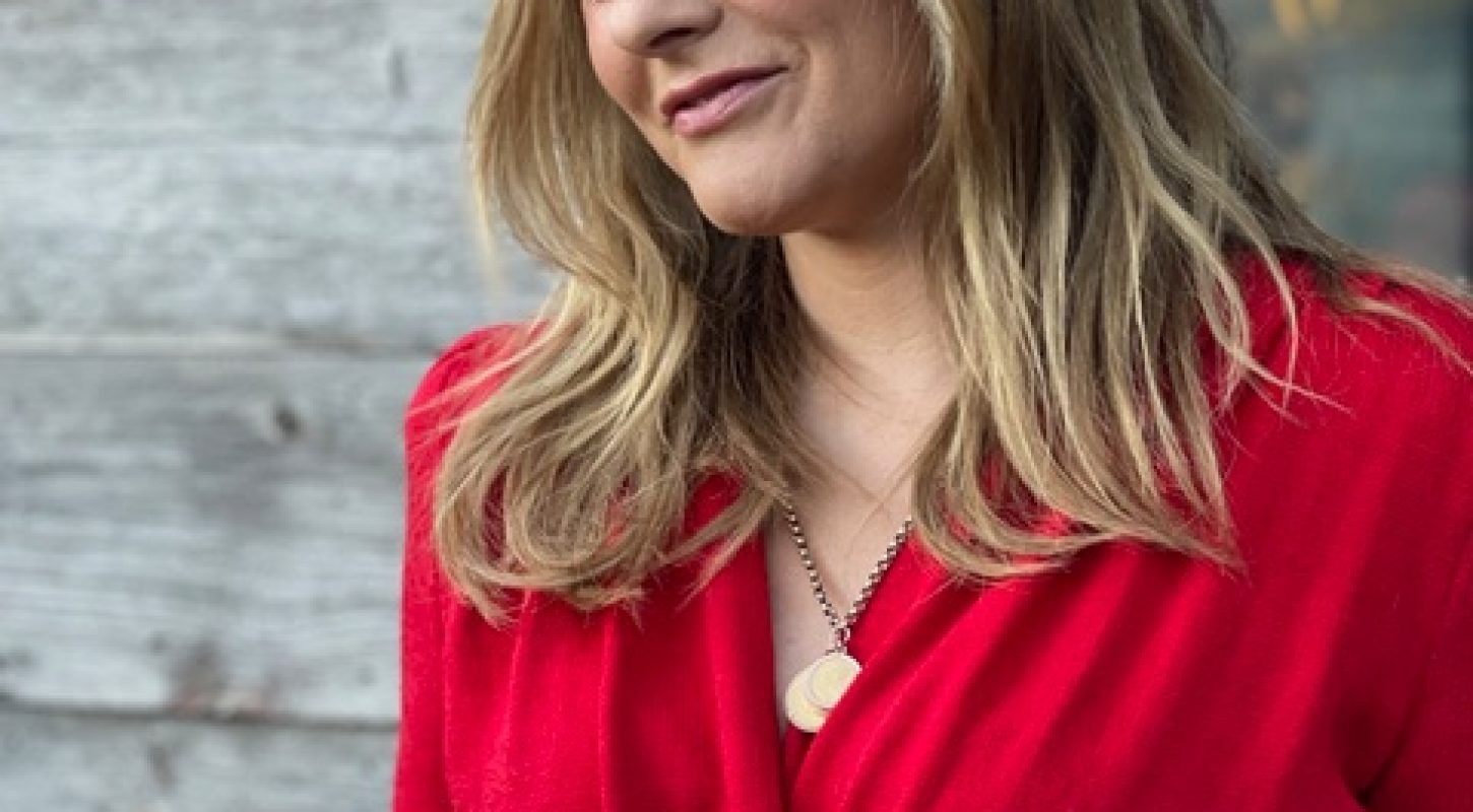 Alicia Silverstone in a red dress.